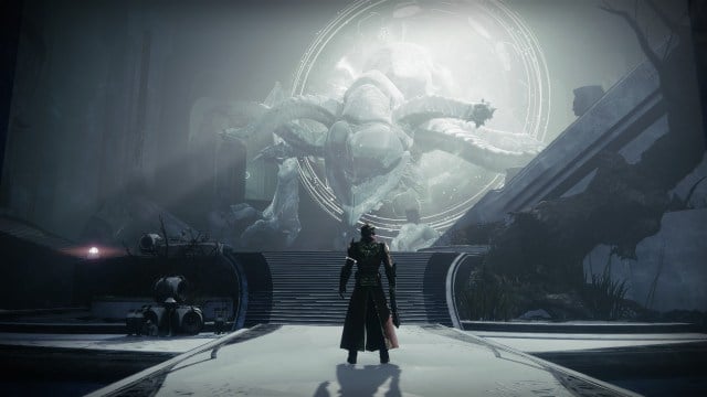 A Warlock stands in front of the Spirit of Riven.