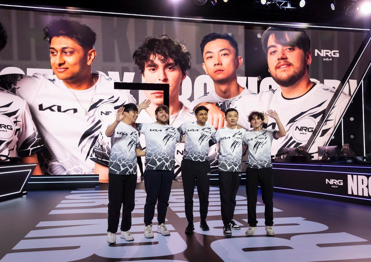 NRG's 2024 LCS roster, consisting of Huhi, Palafox, Dhokla, FBI, and Contractz, wave towards fans after a win.