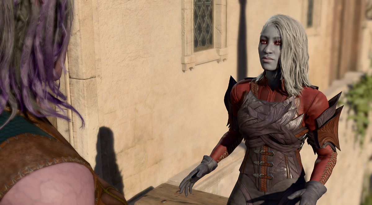 An in game screenshot of Araj Oblodra standing outside of her shop in the Lower City from Baldur's Gate 3.