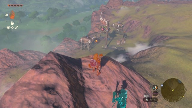 A player stands on a hill overlooking a small encampment in The Legend of Zelda: Tears of the Kingdom.
