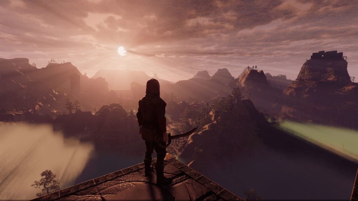 Image of an archer overlooking a massive mountain landscape.