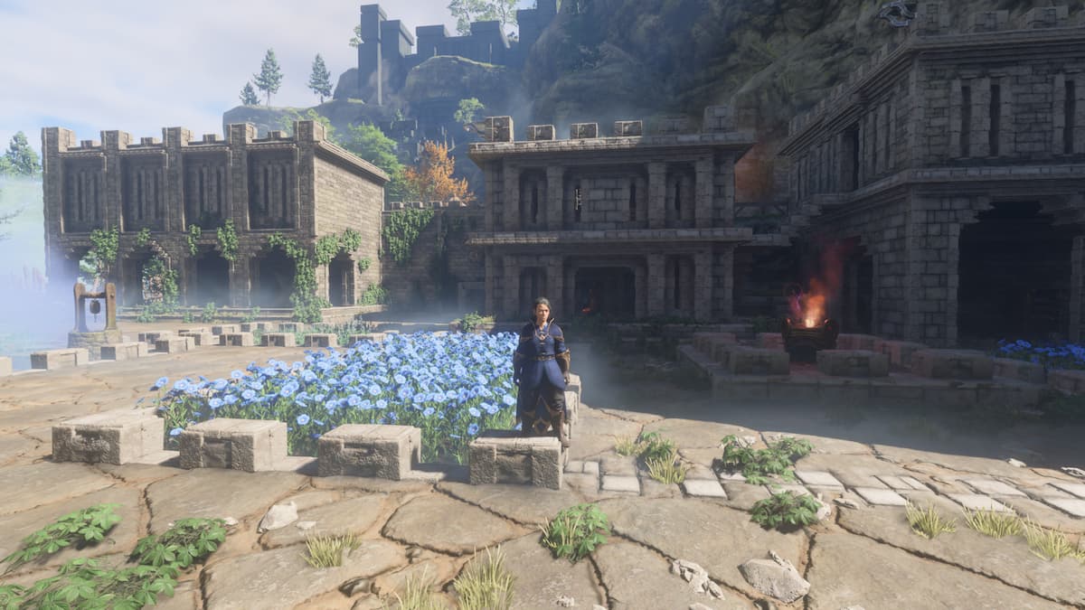 Enshrouded screenshot of a female wizard standing in front of a castle courtyard that has blue flowers