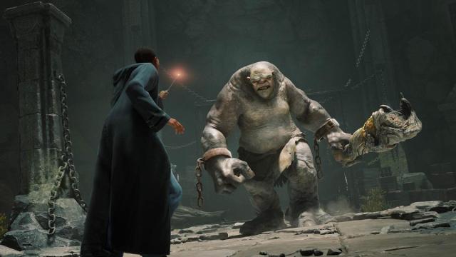 A promotional image of the player character facing a troll in Hogwarts Legacy.
