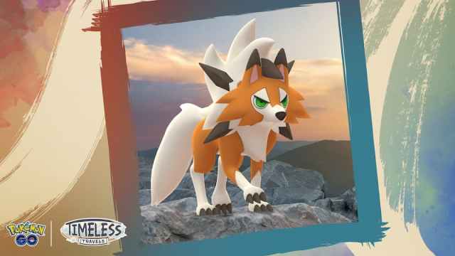 Lycanroc's Dusk Form standing against a sunset.