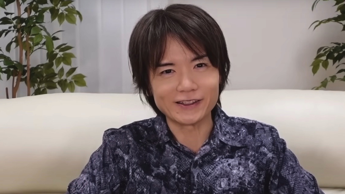 Masahiro Sakurai smiling during a YouTube presentation.
