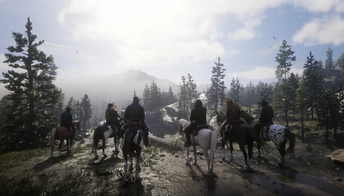 A screenshot of the Red Dead Redemption 2 crew sitting on horses