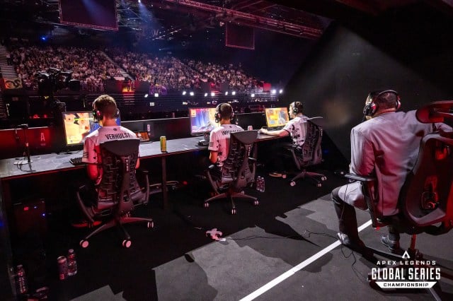 A view from the back of TSM's booth at the ALGS Championship, showing each player's input mid-game. Verhulst and ImperialHal use a controller underneath the desk, while Reps uses keyboard and mouse.