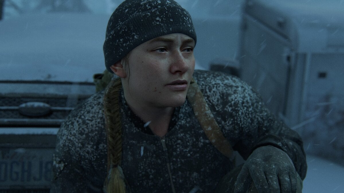 Abby looking at horse footprints to track Tommy and Joel in TLOU2 Remastered