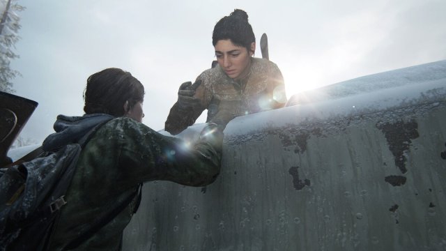 Dina pulling Ellie up onto a truck in TLOU2 Remastered