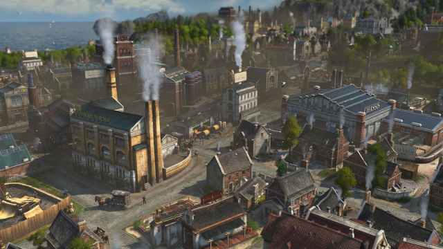 Screenshot of big factories in the industrial area of the city in Anno 1800