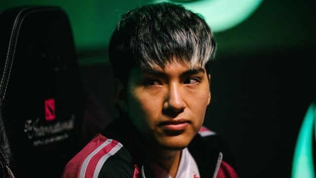 StingeR, a Dota 2 player, stares forward at his desk at The International.