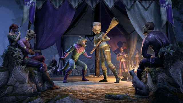 Two ESO characters stand inside a circle of people under a tent watching them. One is wearing an animal mask and the other has a bucket on his head and is holding a broom.