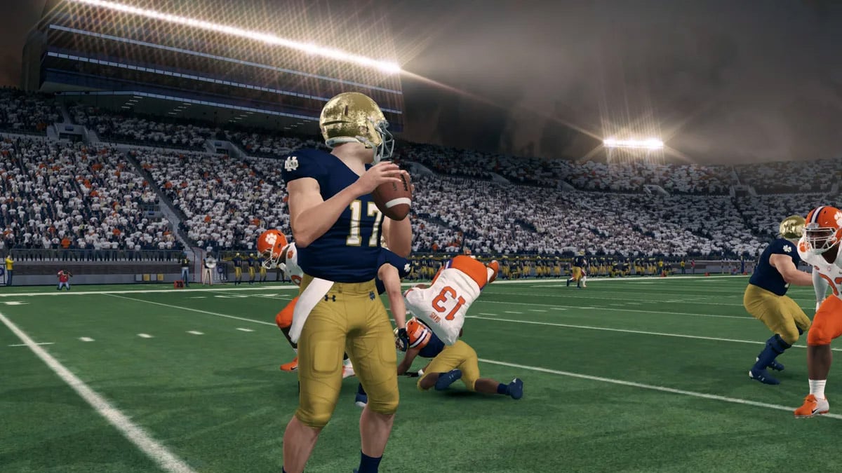 A quarterback prepares to throw a football in NCAA 14 CFB Revamped.