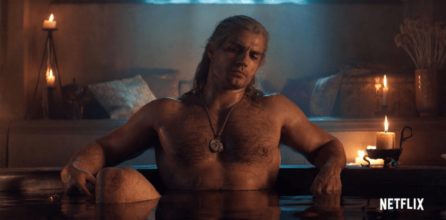 Henry Cavill as Geralt of Rivia sitting in a bathtub in The Witcher show.
