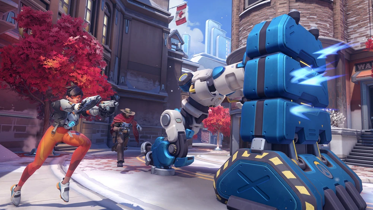 Tracer and other characters running around a robot pushing barricade.