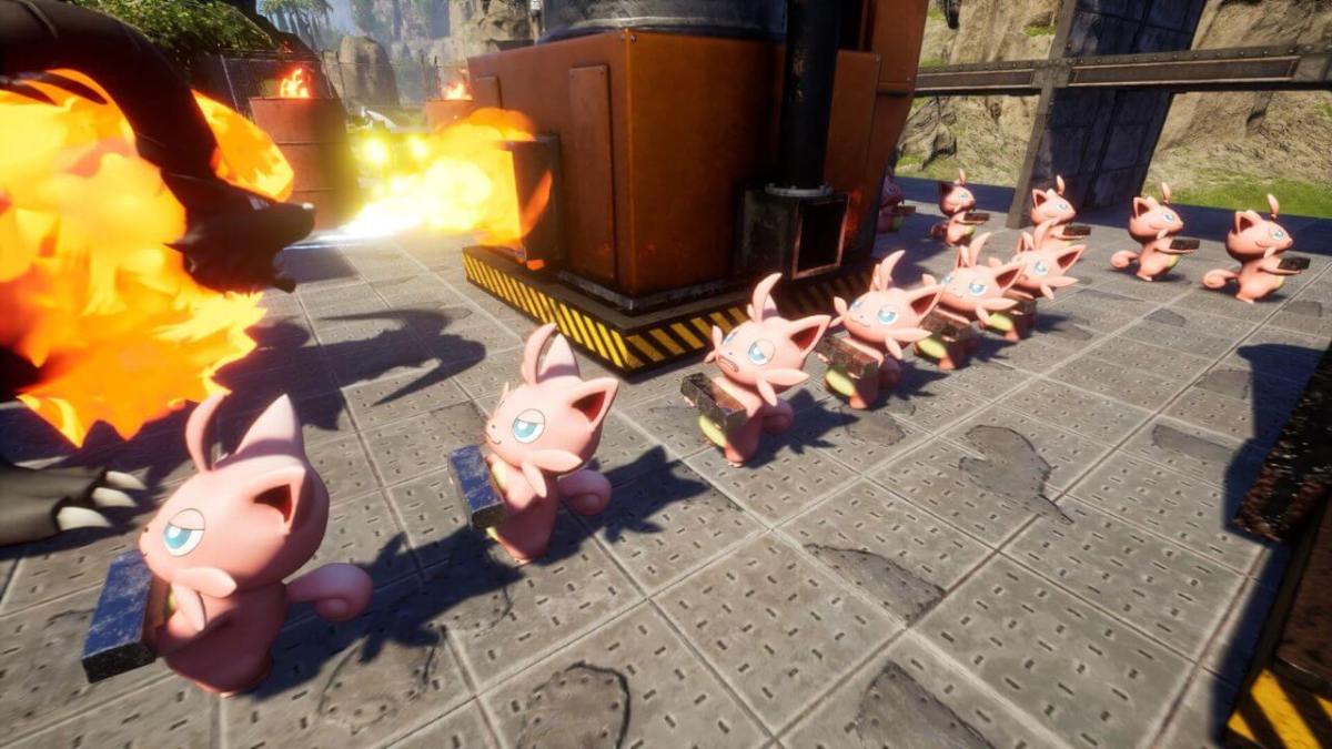 An image from Palworld showing a group of pink, cartoonish creatures lined up in formation, with one breathing fire near industrial-looking equipment on a metal grid floor, in a sunny outdoor setting.