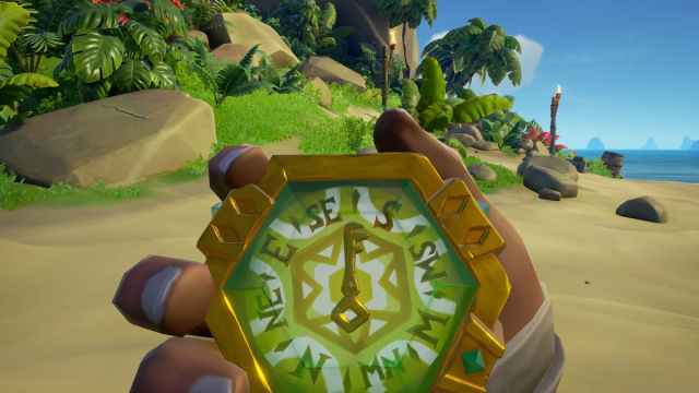 Pirate holding a compass in Sea of Thieves