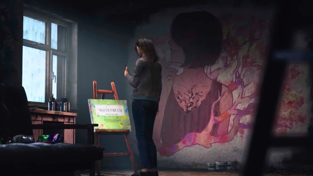 woman standing in front of a canva next to a mural in silent hill the short message