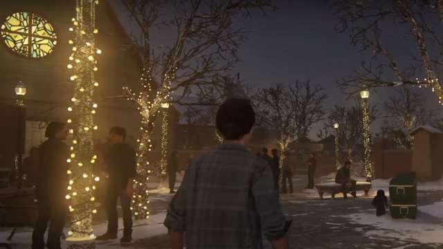 Ellie wlaking in a snowed street with trees and fairy lights in The Last of Us 2.