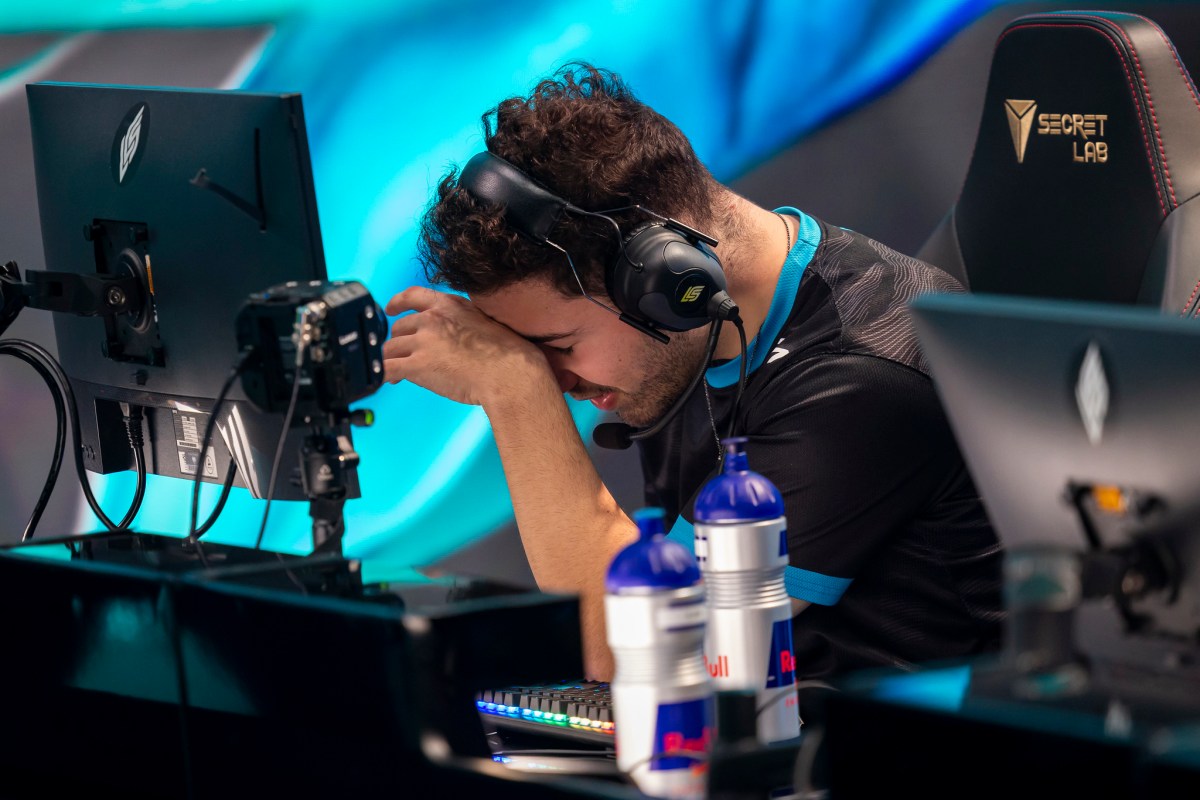 C9 Fudge with his head in hands on the LCS stage, Spring 2024