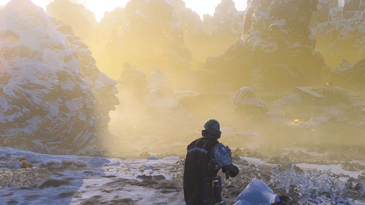 A Helldivers character walks forward into a yellow mist on a rocky planet.