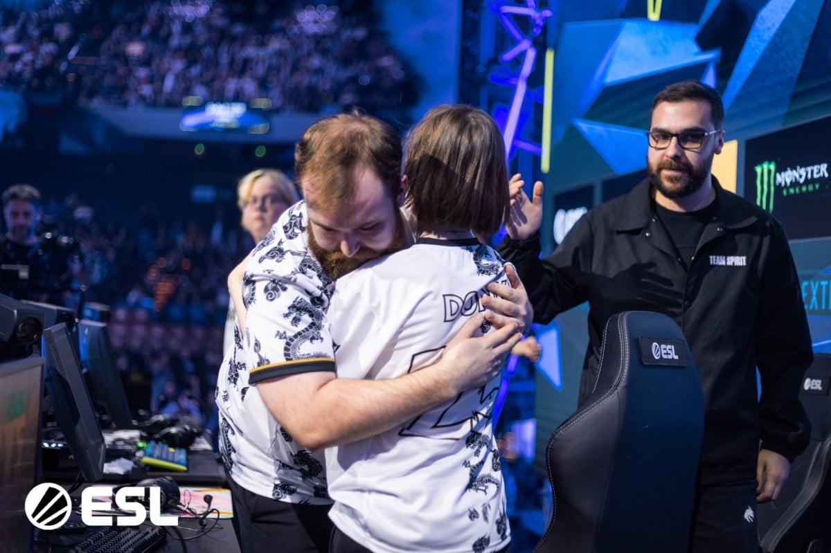 Team Spirit players Chopper and Donk embrace on the IEM Katowice stage