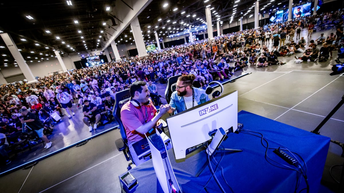 Photo of two players on an Evo stage shaking hands after a set.
