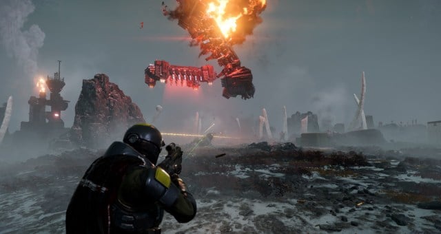A character in Helldivers 2 looks at a ship crashing into the ground.
