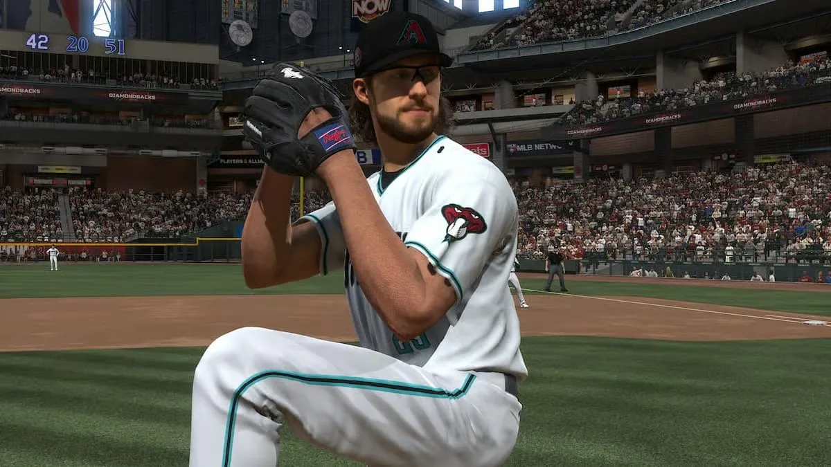 A baseball player prepares to throw a pitch in MLB The Show 24