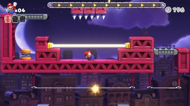 Mario ducking under a laser