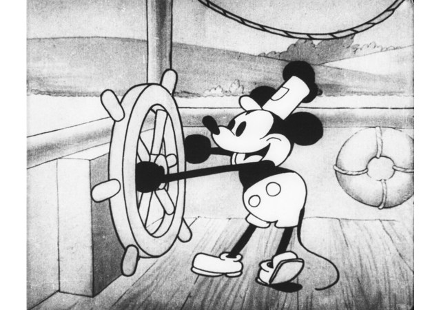 Image of Steamboat Willie holding a wheel with a black and white cartoon style present around the character.
