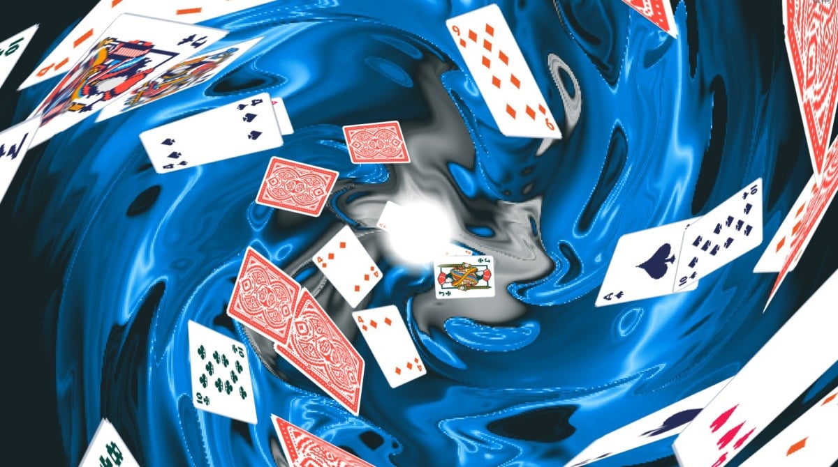 The Balatro loading screen with playing cards swirling into the unknown.