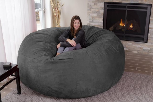 Young woman sitting on an 8' Chil Sack Bean Bag