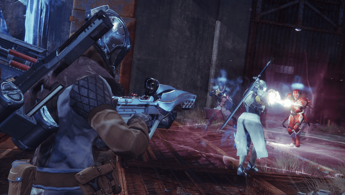 Two Guardians face off against an enemy Titan and Warlock in a match of the Crucible.