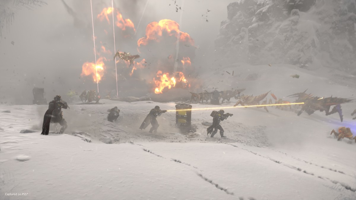 A squad of Helldivers fighting Terminids on a snow planet in Helldivers 2.
