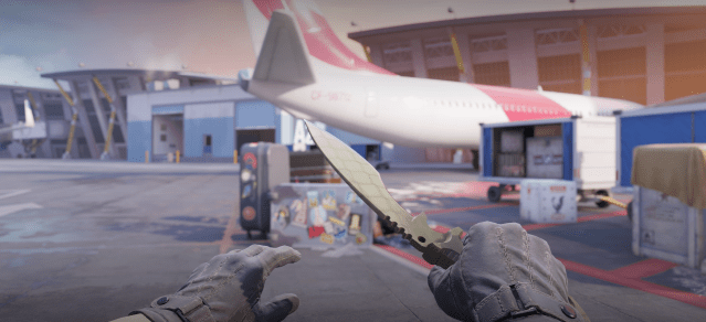 A player holds a Kukri Knife outside of a plane in CS2.