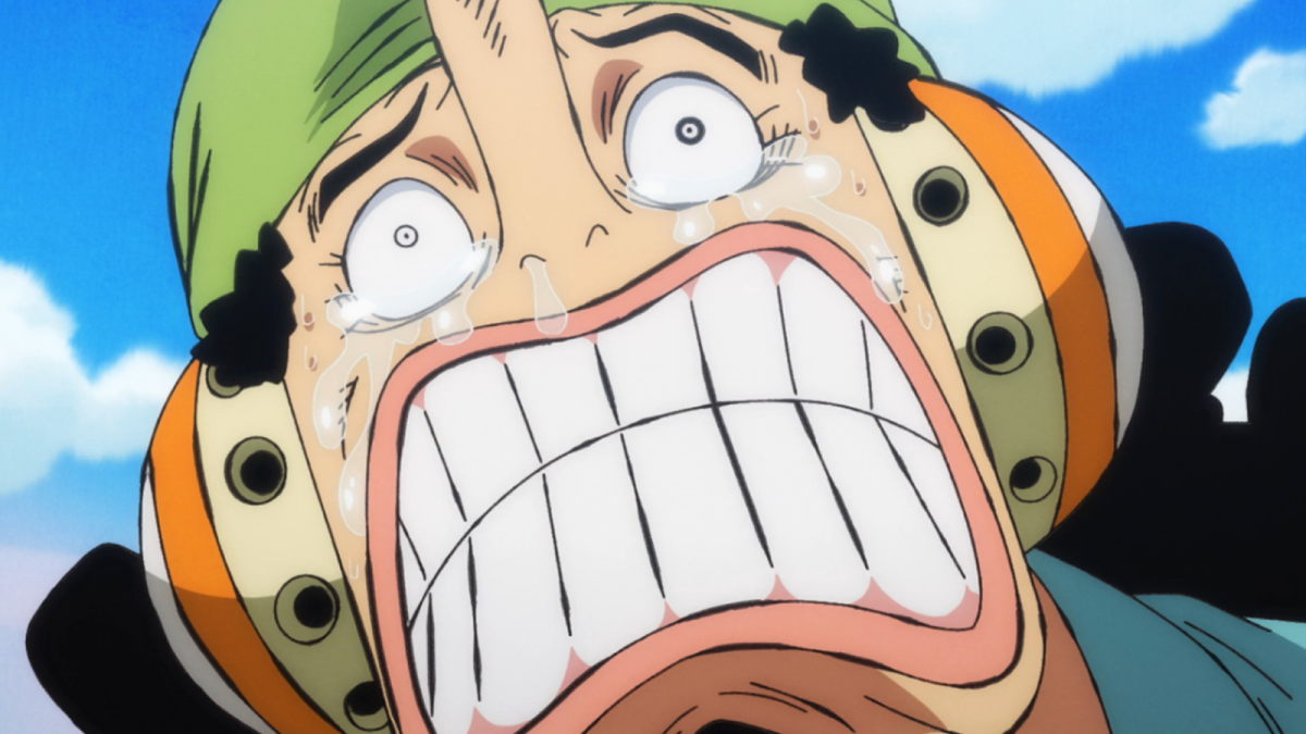 Usopp from One Piece grimaces while crying in a green Wano cap