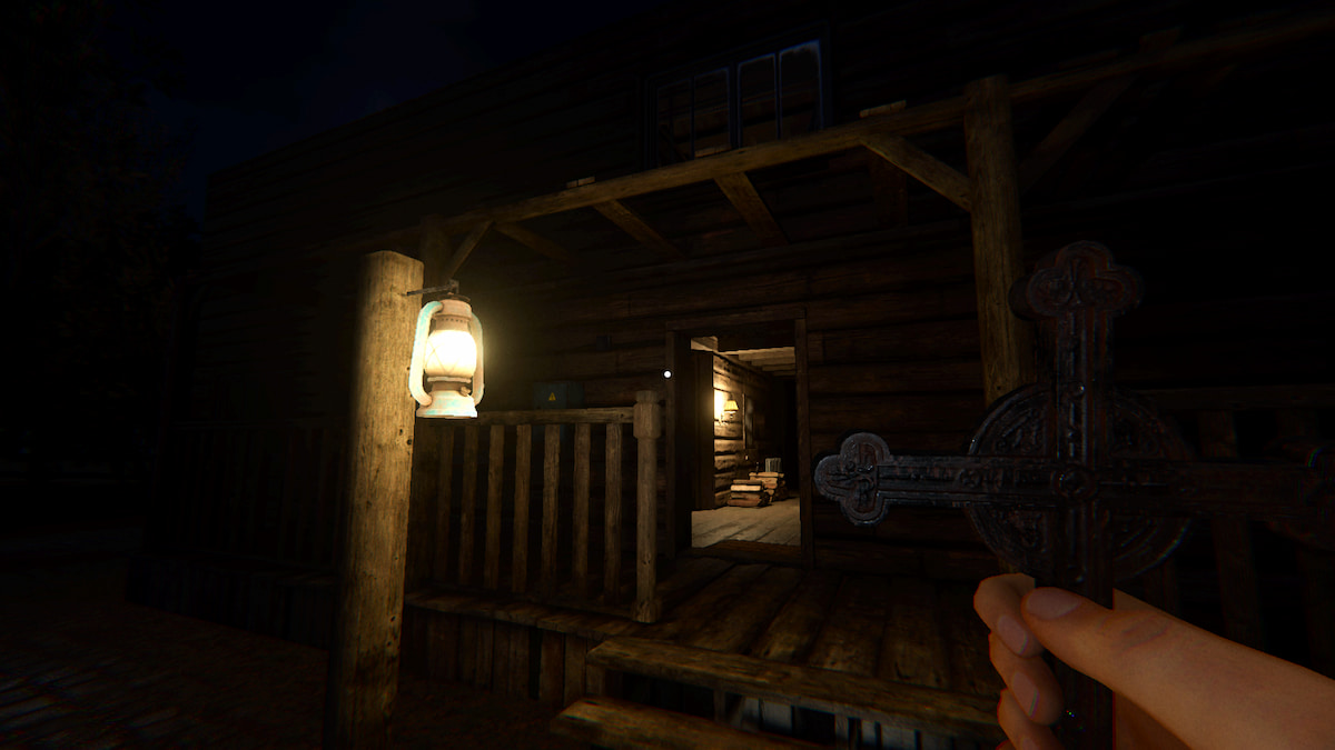 A player holding a Crucifix while looking at the front of Grafton Farmhouse in Phasmophobia.