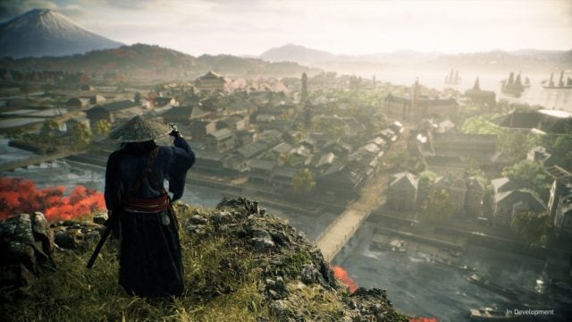 A Ronin, standing on top of a cliff, looking down on a settlement across a river.