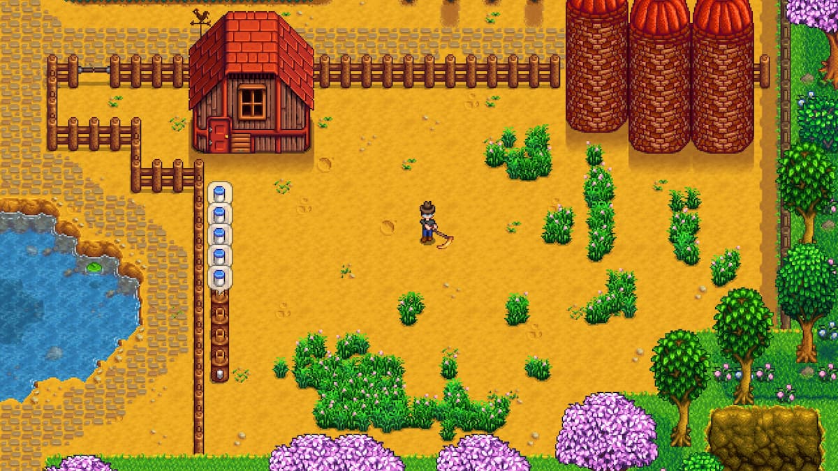 The player is using the Golden Scythe in Stardew Valley