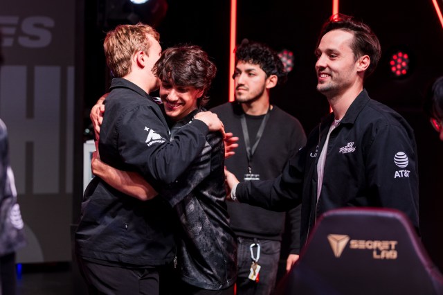 The 100T squad celebrate a win on-stage in the LCS Spring Split.