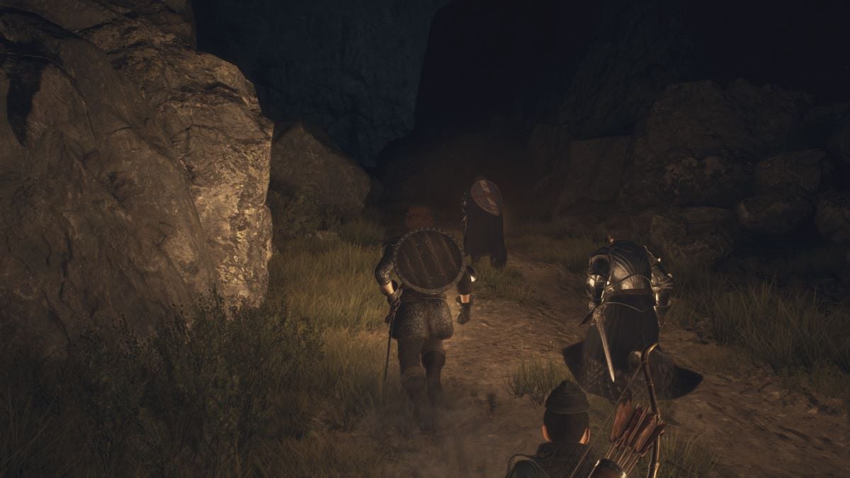 A Dragon's Dogma 2 screenshot that shows the Arisen traveling with Gregor at night.