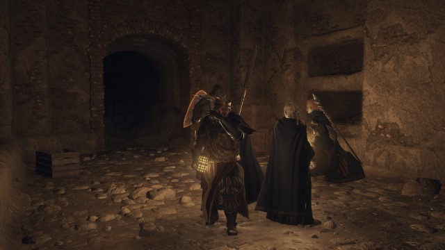 A Mystic Spearhand high-fives a pawn in a crpyt of Dragon's Dogma 2.