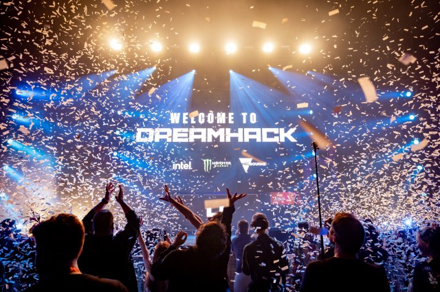 People cheer in front of the DreamHack Melbourne stage as confetti flies.