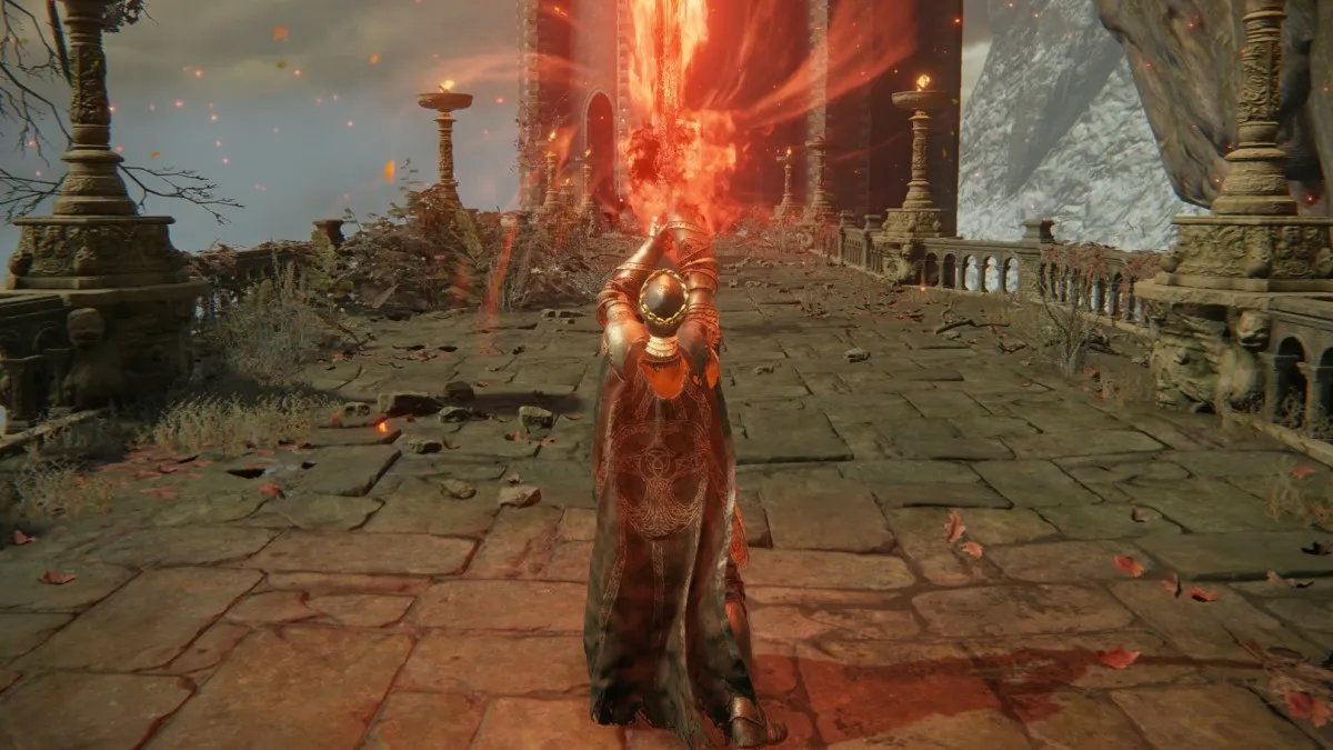 A man holds a gigantic, burning sword above his head in Elden Ring.