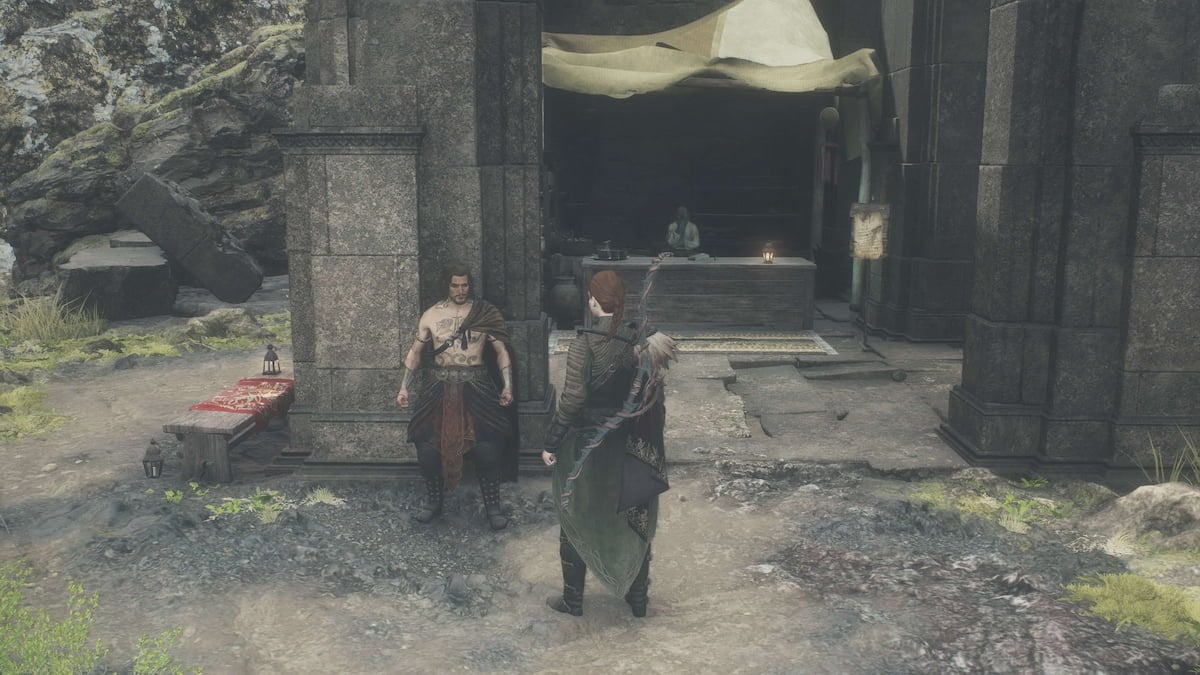 Two Dragon's Dogma 2 characters speak to each other in a courtyard.