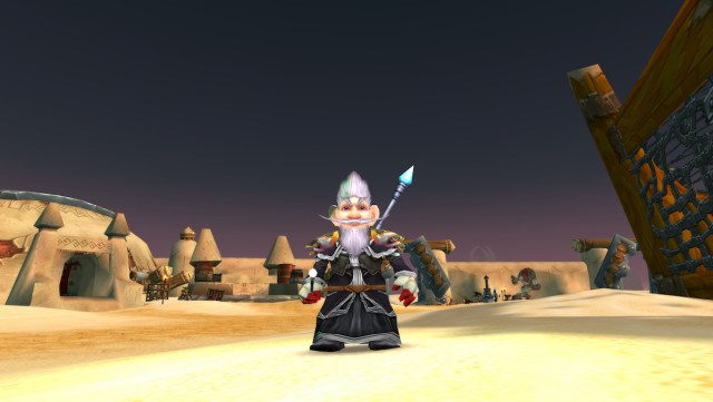 A Mage standing in Tanaris in WoW Classic holding the Consecrated Wand