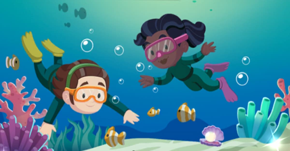 Two women diving in ocean water
