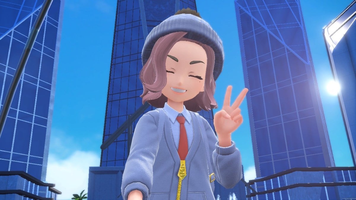 Pokémon Scarlet and Violet selfie in front of Paldea Realty buildings