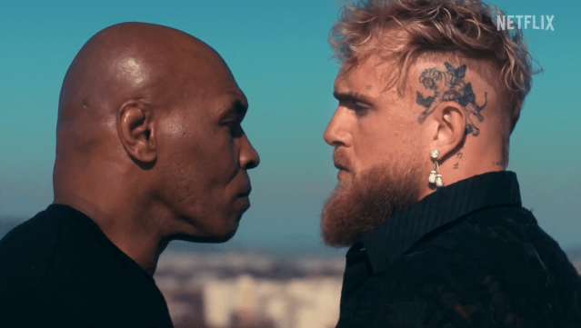 Jake Paul and Mike Tyson longingly and fiercely look each other in the eyes in a promo for their Netflix boxing match